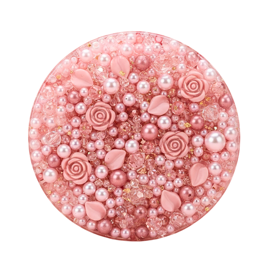 Top down close up of the picky pad filled with pink pearls, rose charms, and shimmering beads.